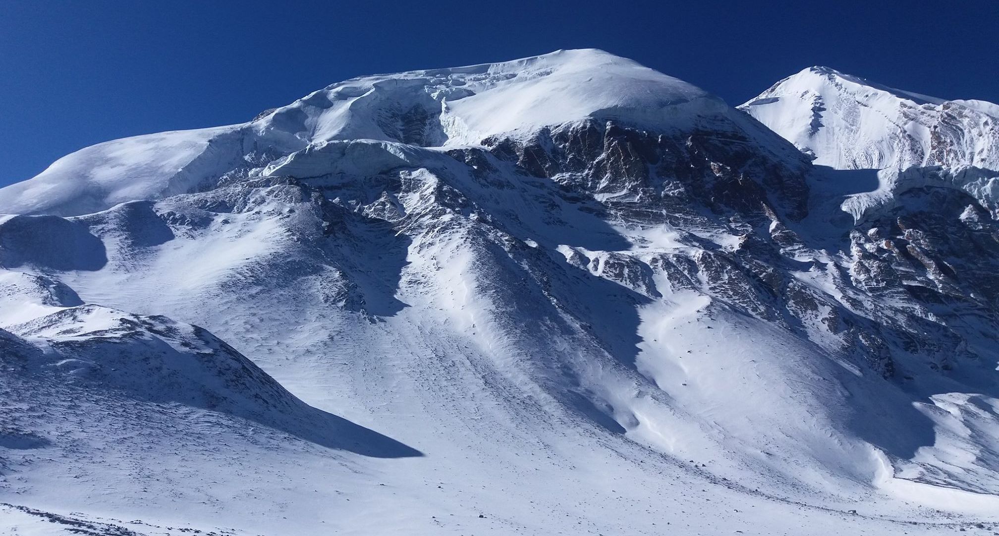 Tharong Peak ( Thorong Ri ) above Tharong La on crossing Tharong La high pass on Annapurna circuit trek in the Nepal Himalaya