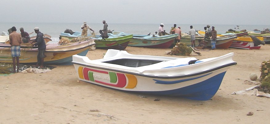 Fishermen and Boats on the beach at Fishing Village in Negombo